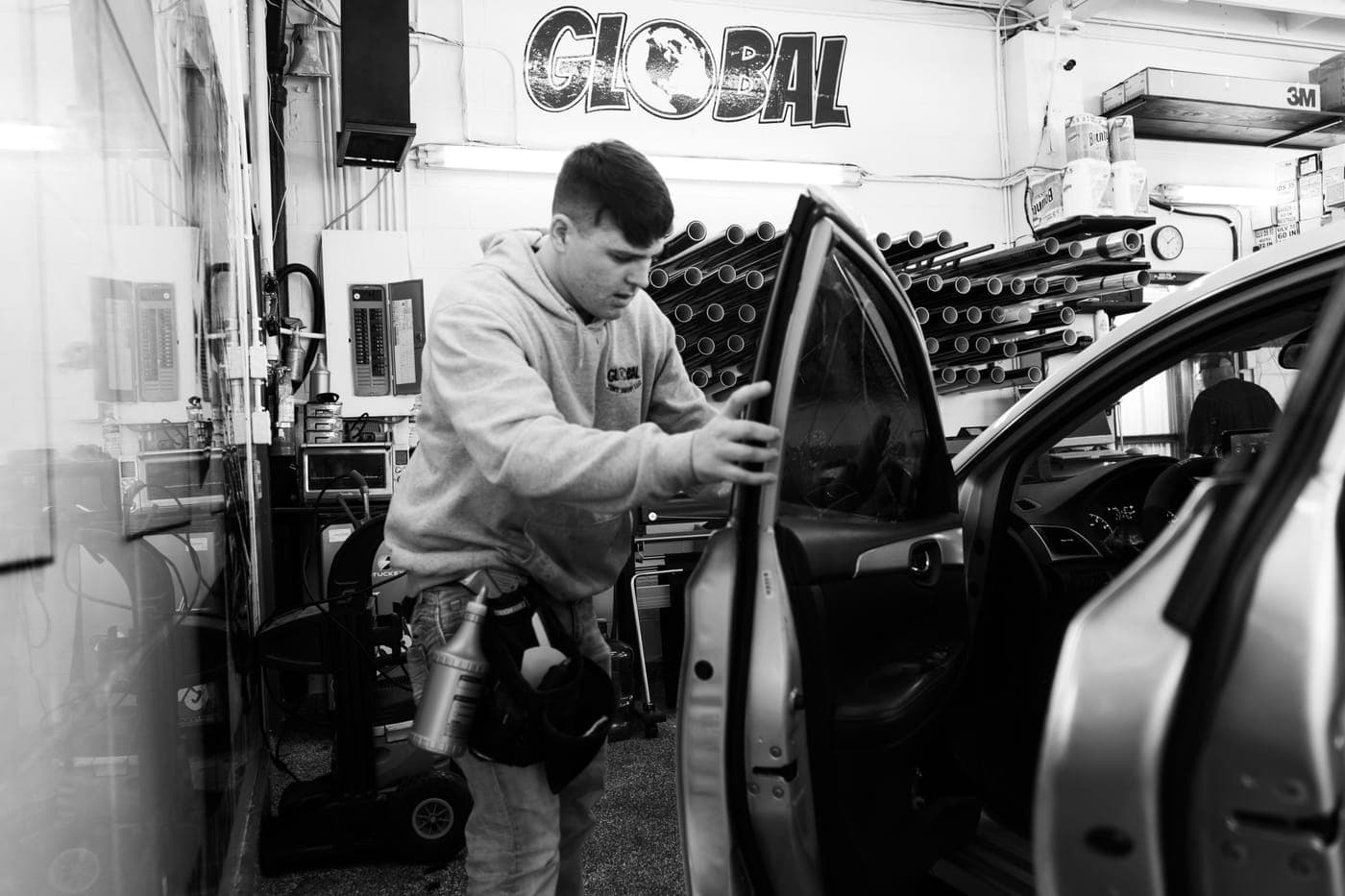 Installing door film inside the shop