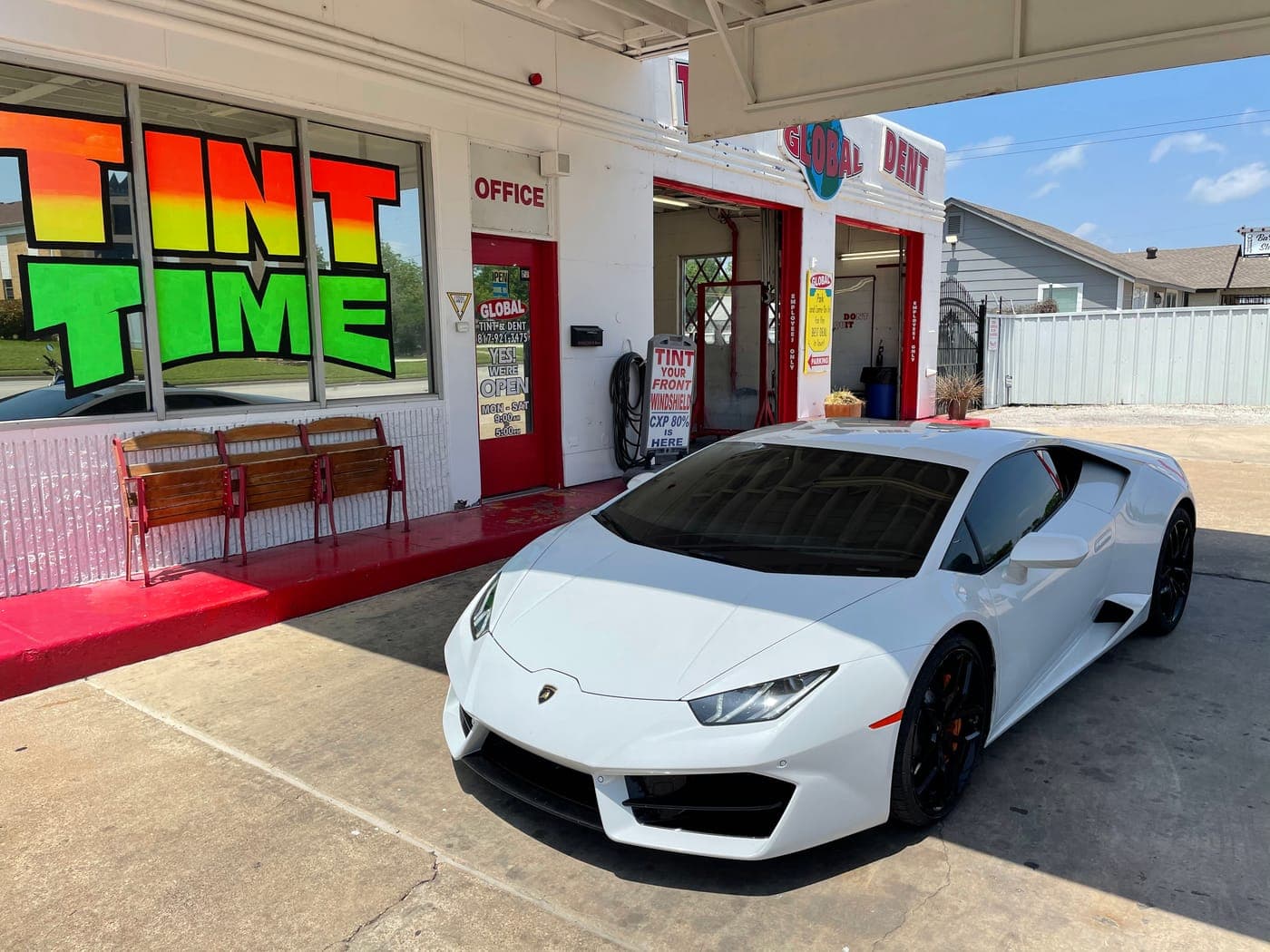 White Lamborghini Huracán outside the shop
