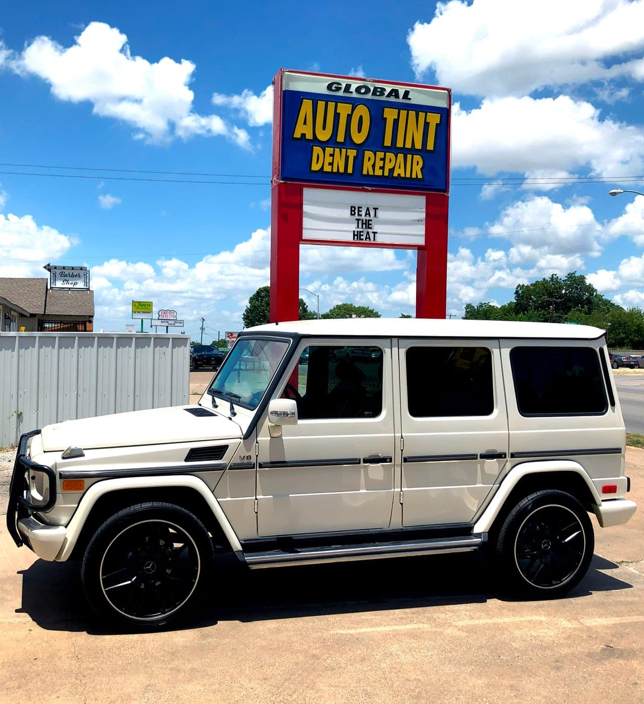Mercedes G-Wagon in front of the Auto Tint sign