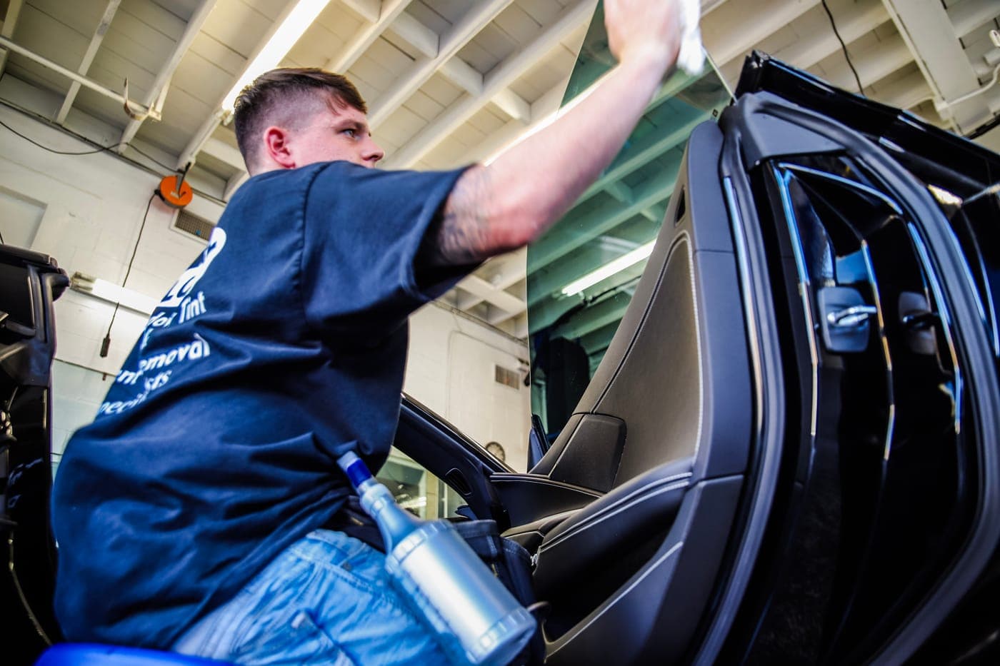 Squeegeeing film onto a convertible window