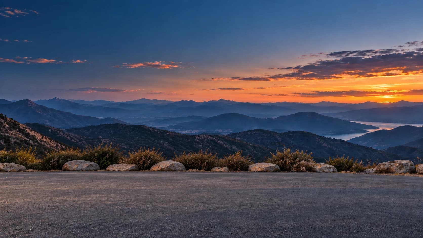 Layered blue mountains at sunset